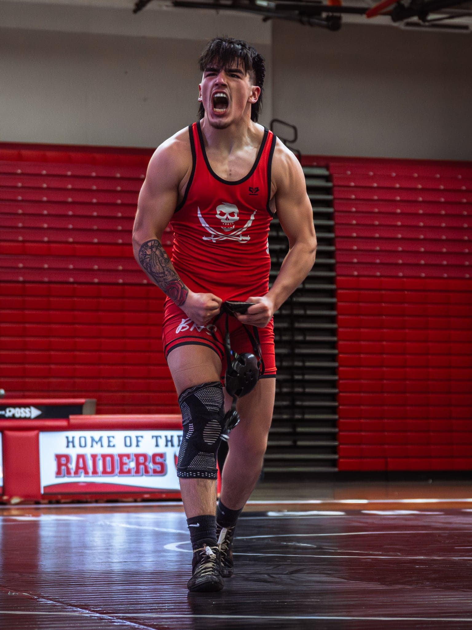 A wrestler celebrating after the whistle