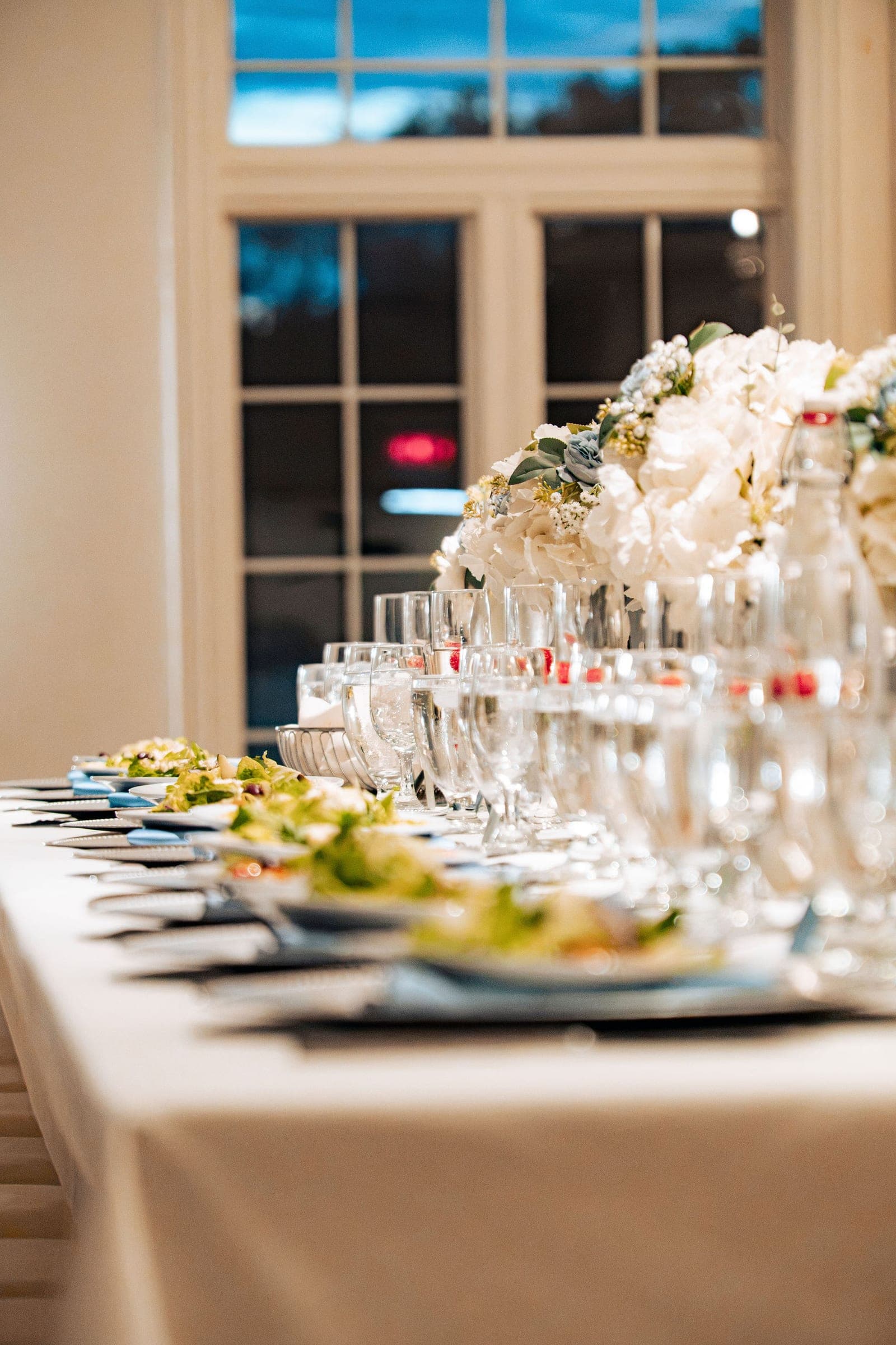 Glassware and place settings waiting at dusk