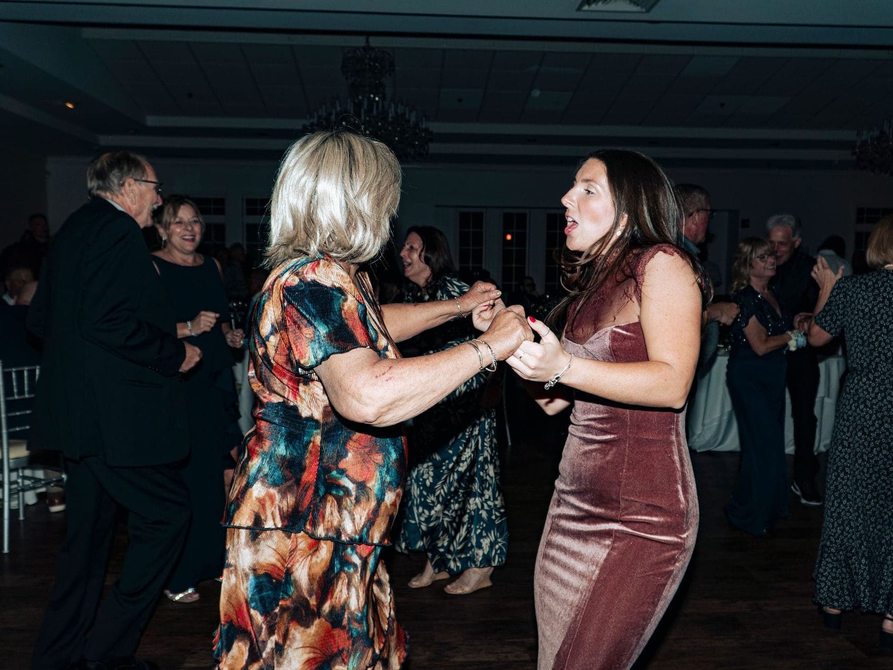 Guests of every age dancing together at a Chicagoland wedding