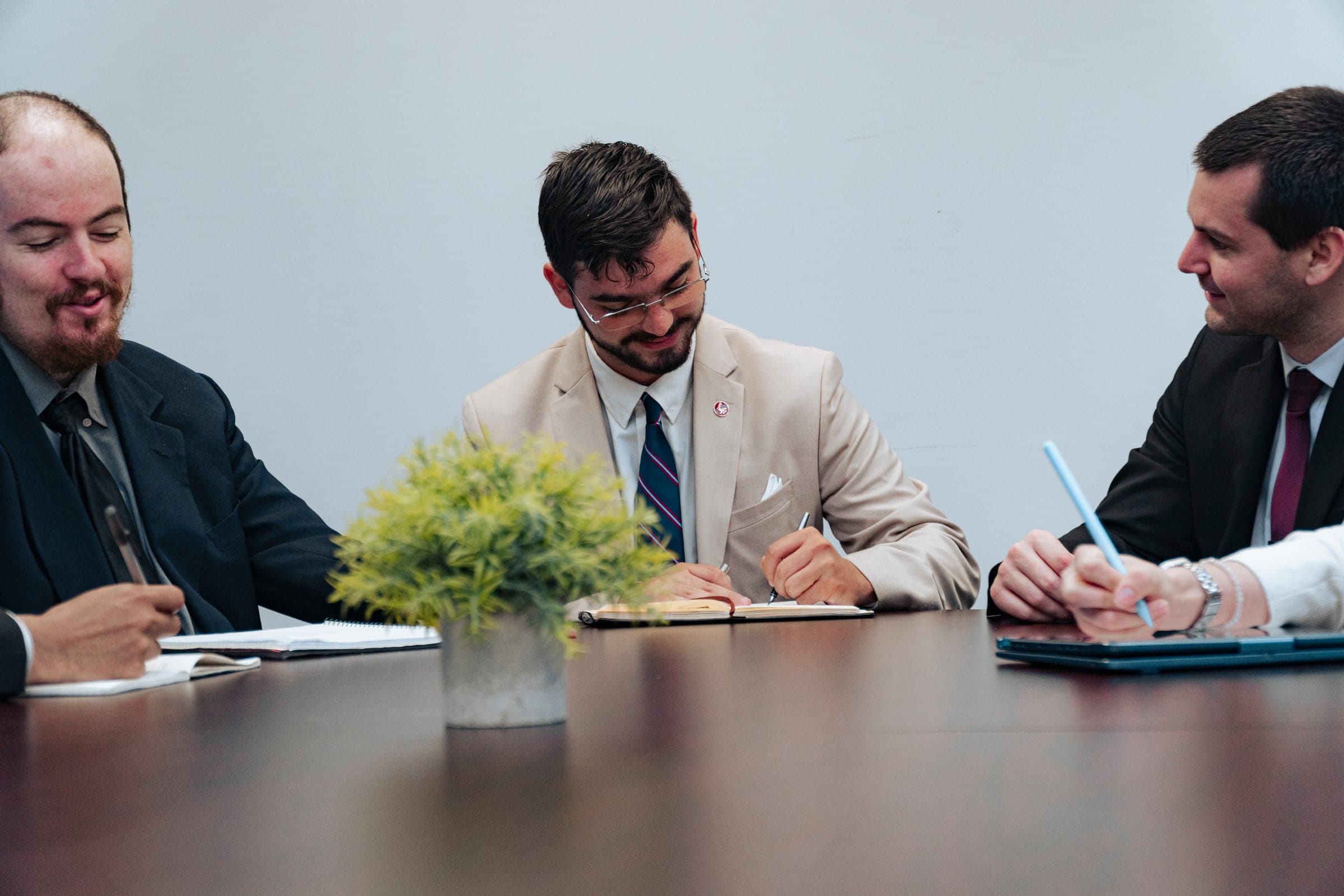 Colleagues taking notes together during a working session