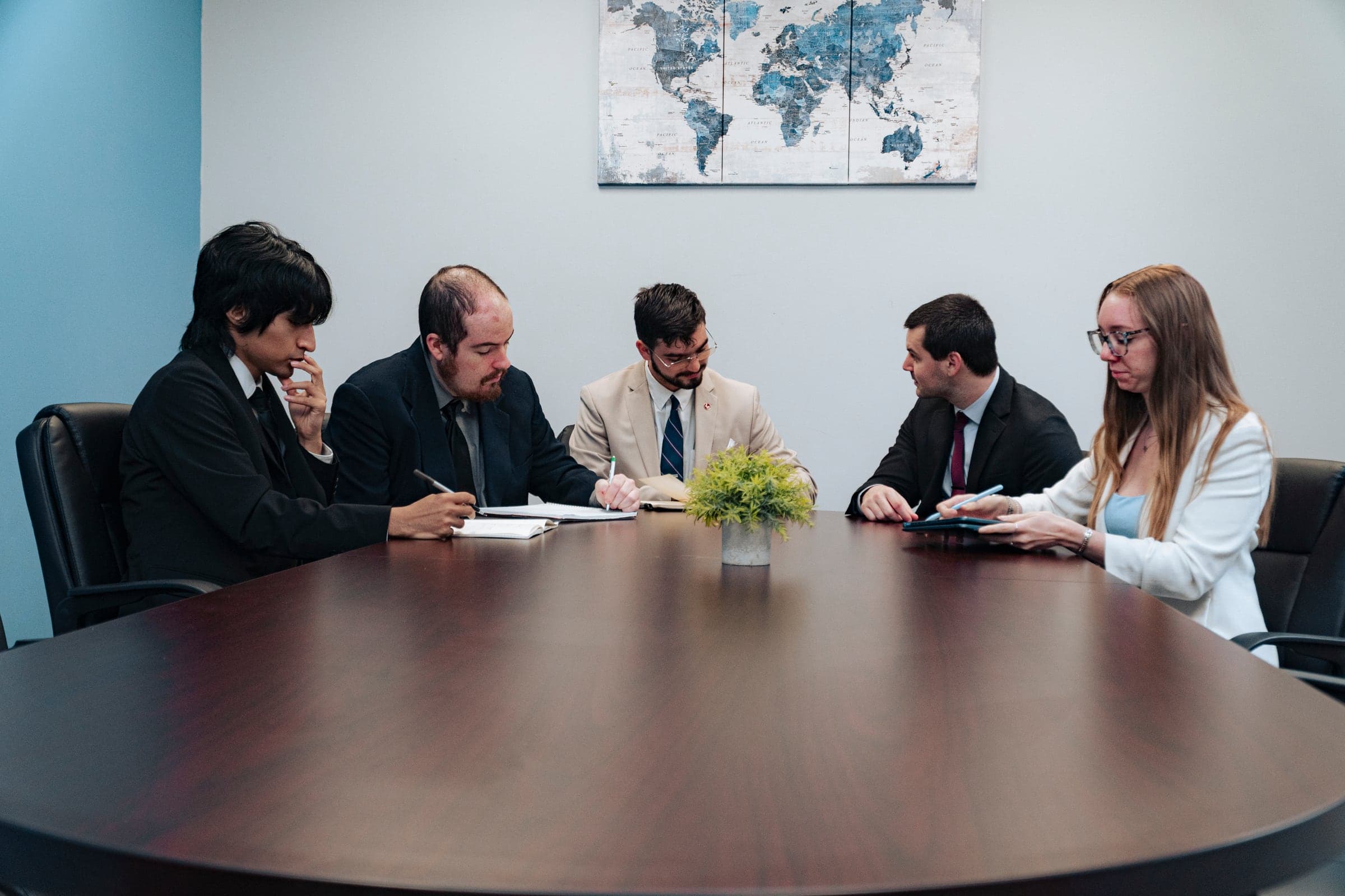 Colleagues working through documents together at the table