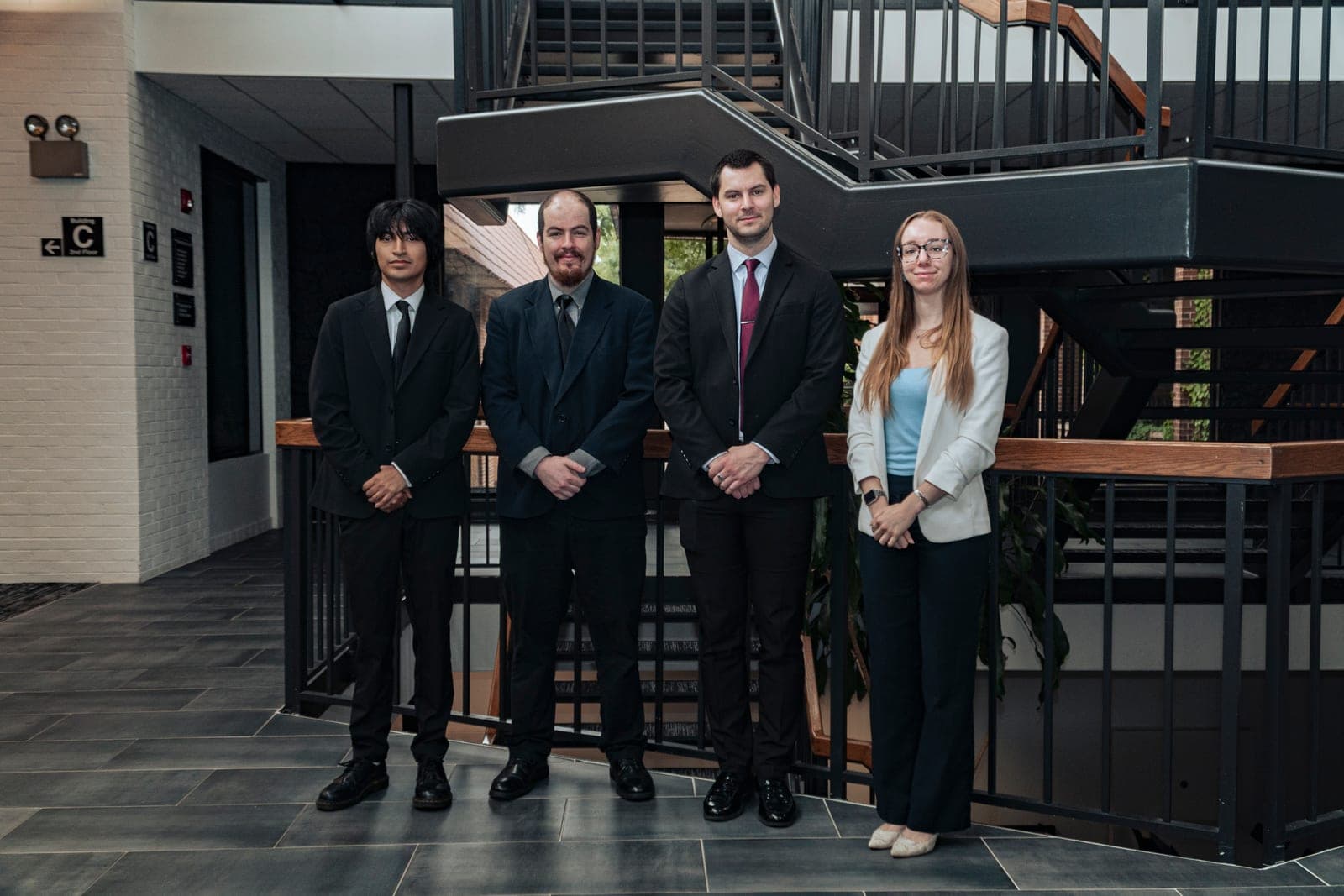 A company team portrait in an office atrium