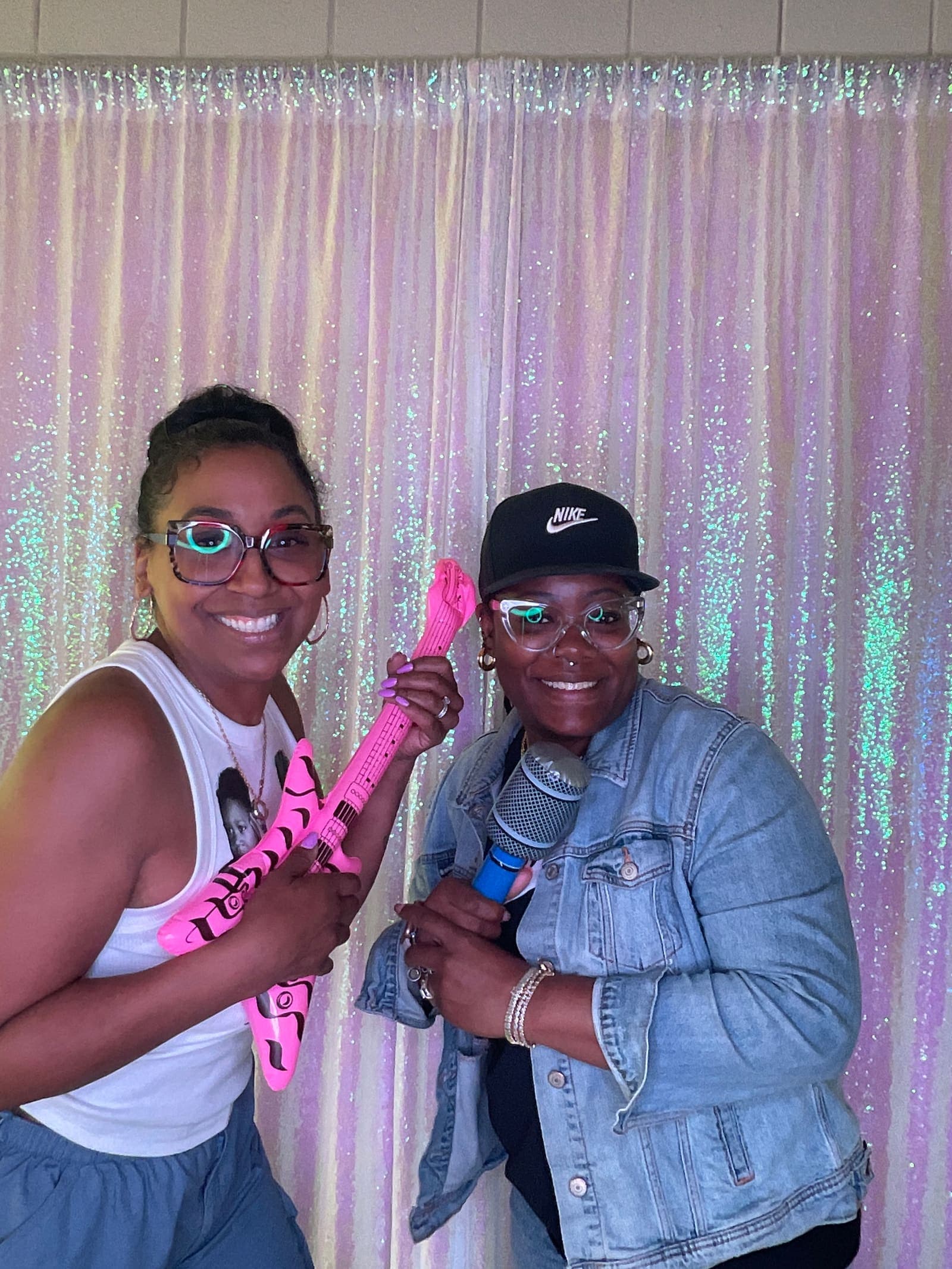 Graduation party guests posing in the photo booth
