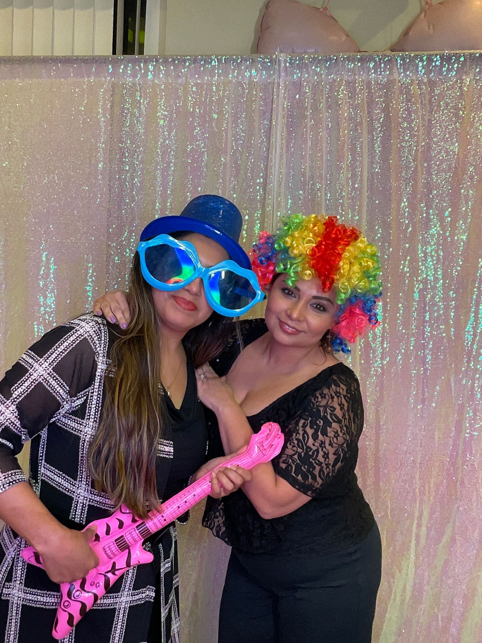 Friends packed into the photo booth at a birthday party