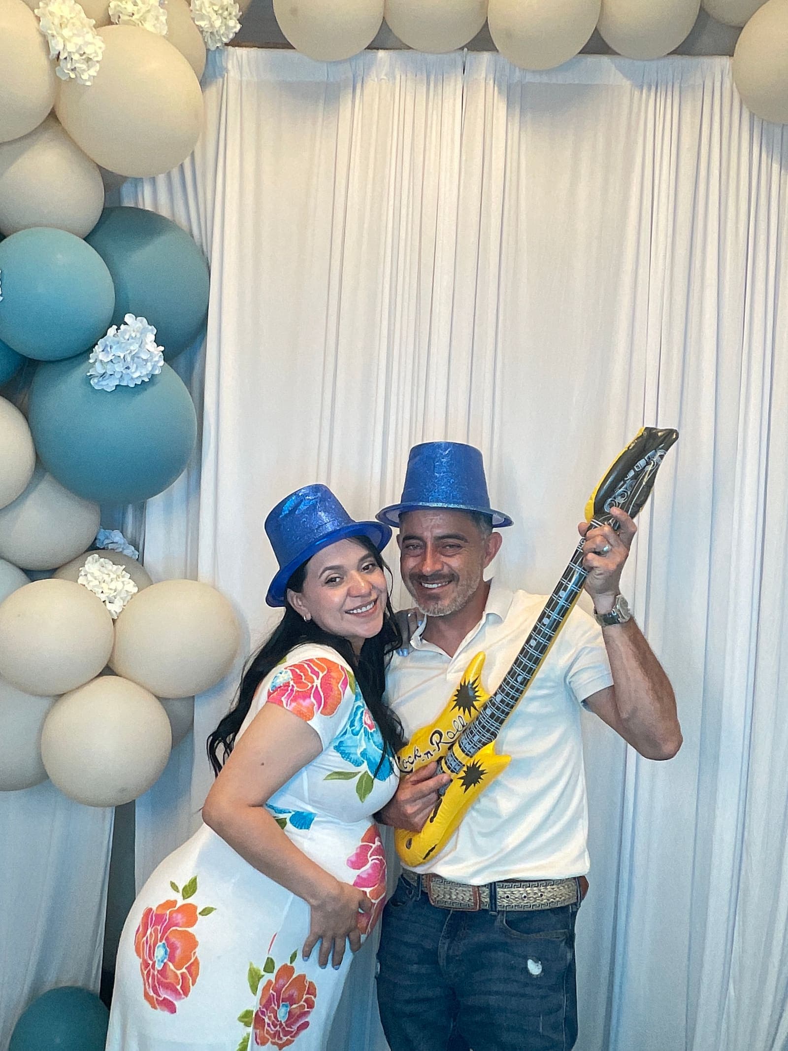 Quinceañera guests posing in the photo booth