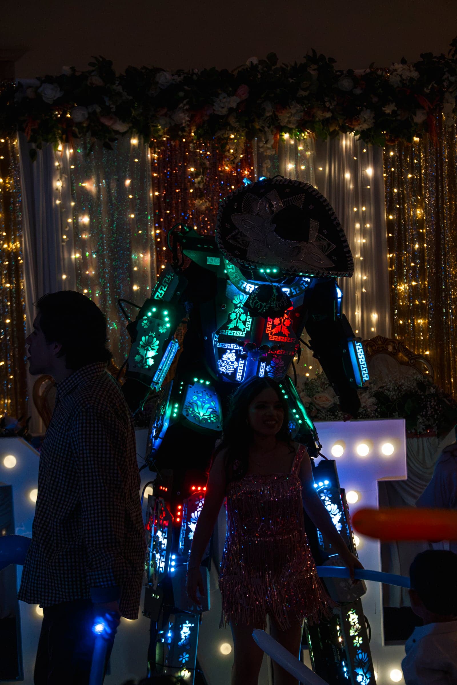 An LED performer lighting up the dance floor at a quinceañera