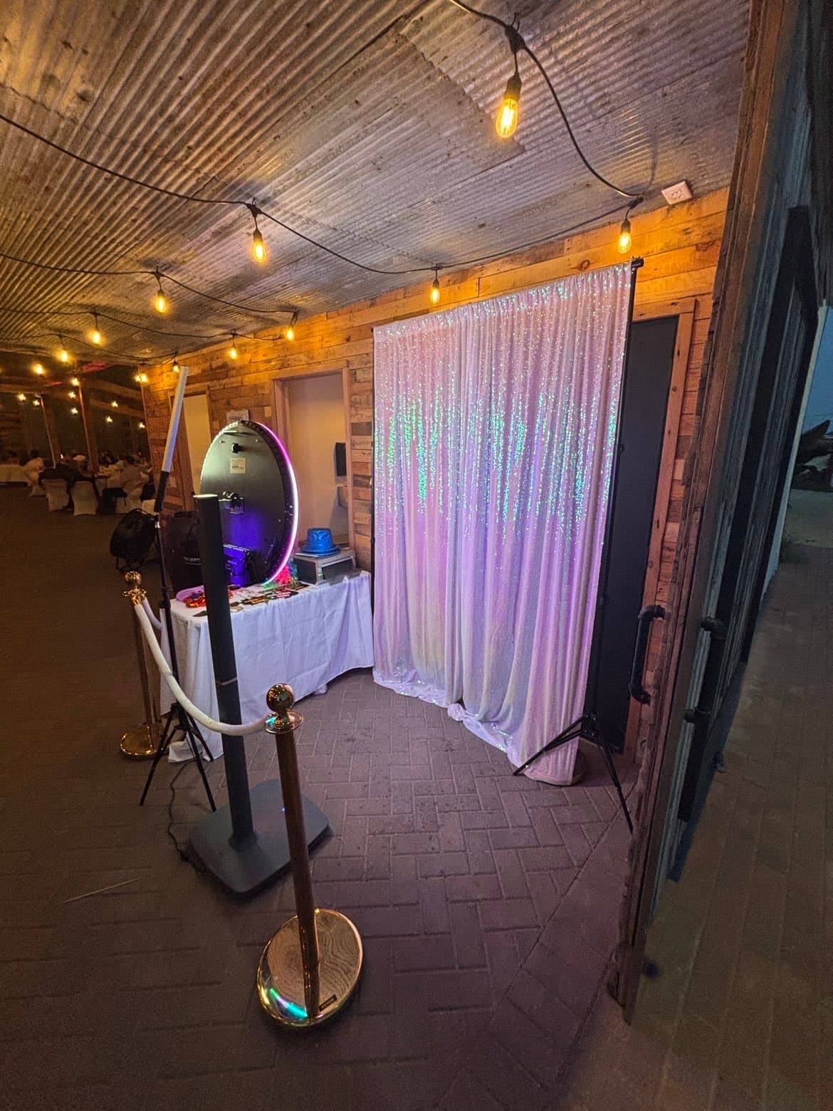 Guests at the booth against a shimmering sequin backdrop