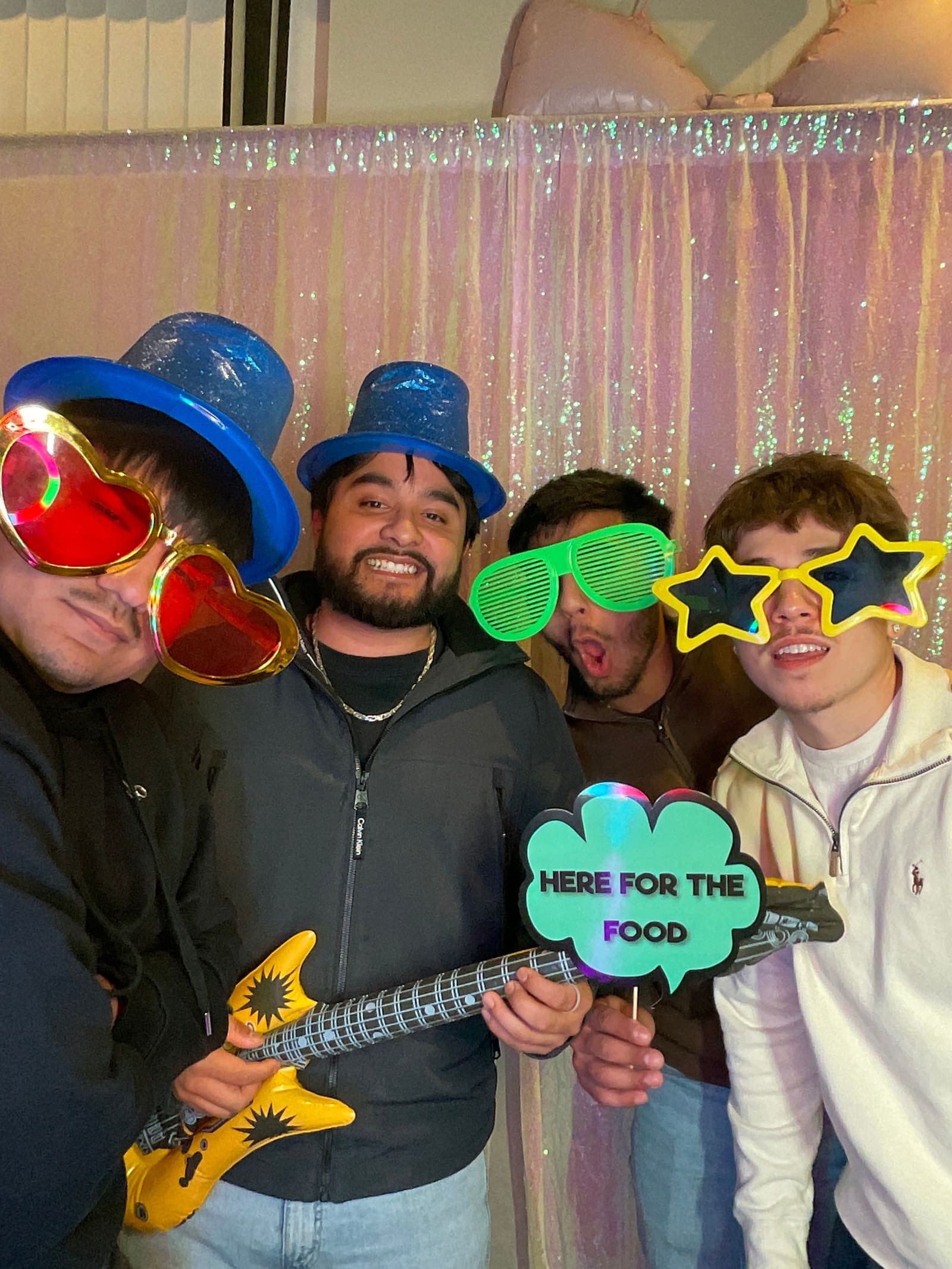 Guests laughing in the photo booth at a Chicagoland birthday party