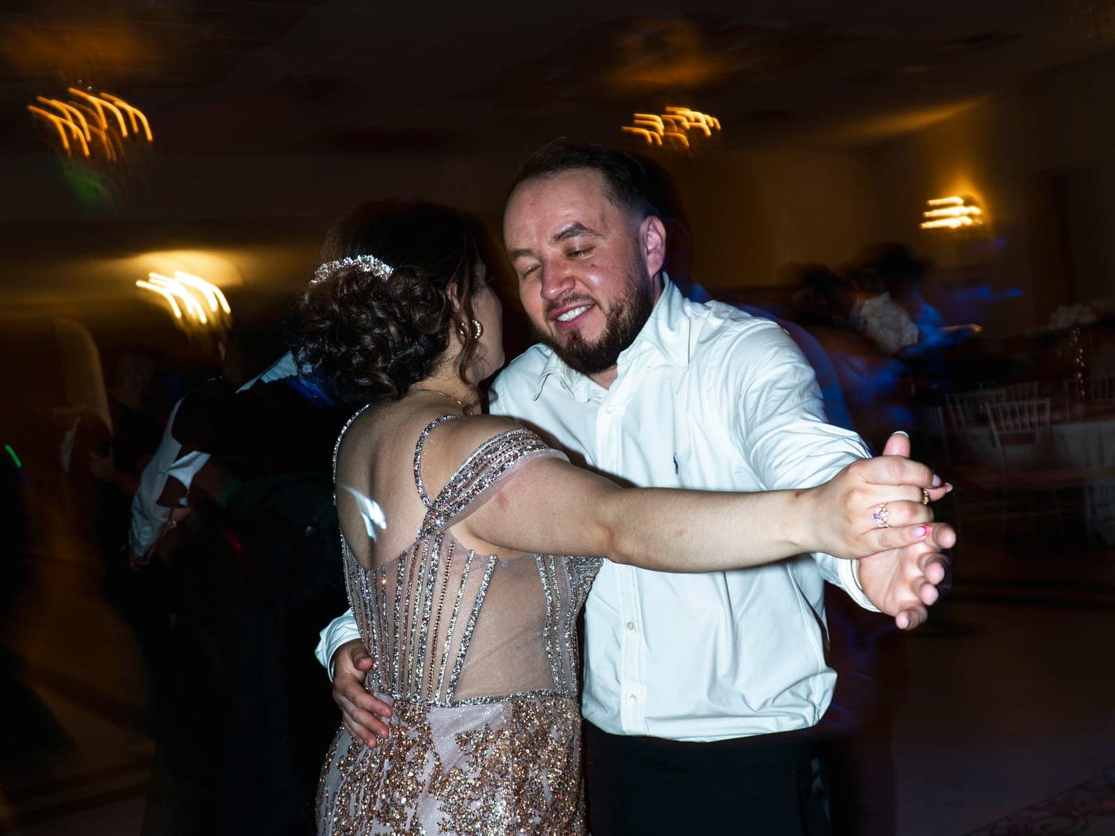 A slow dance caught in a long exposure of moving light