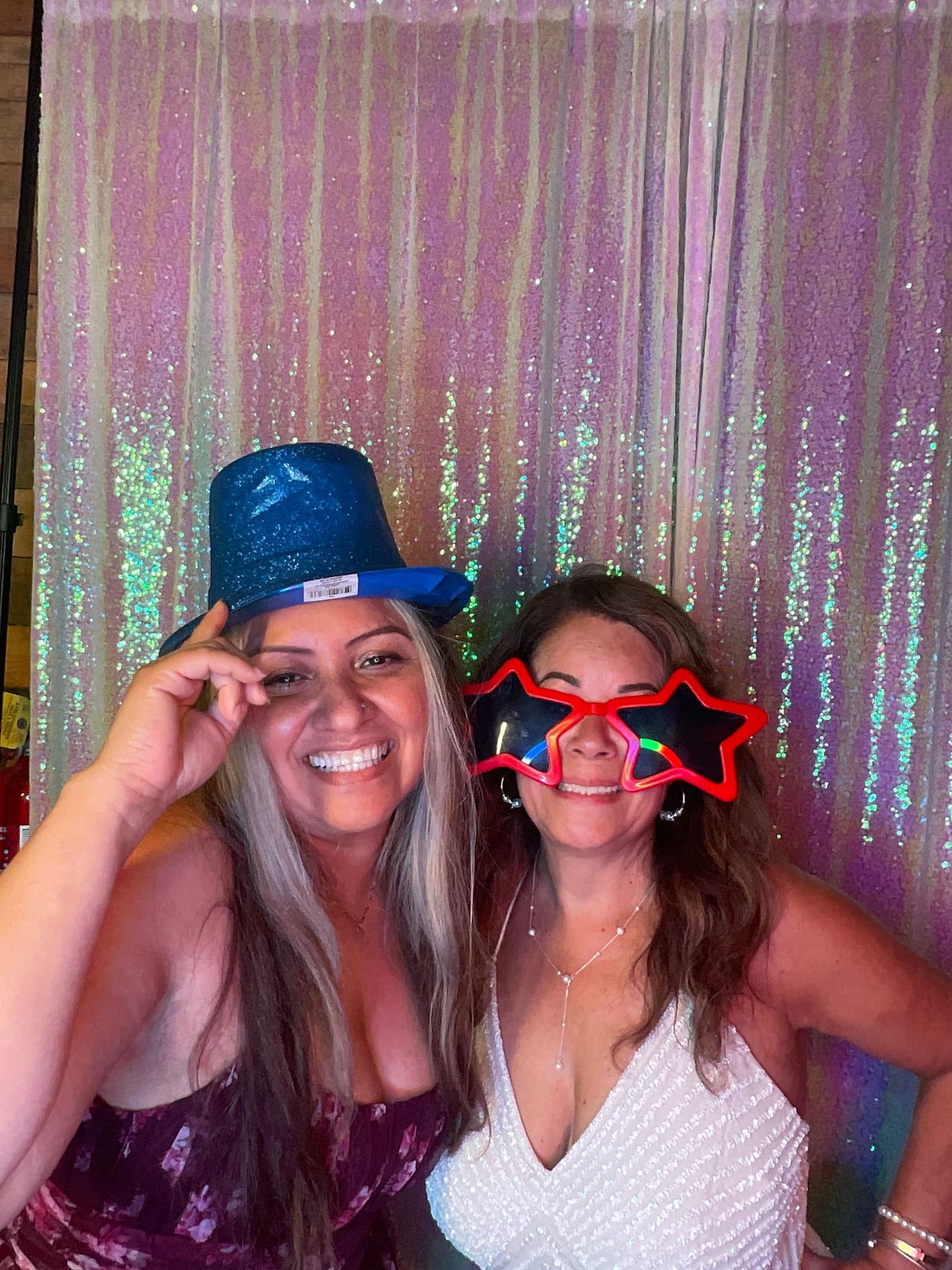 Guests posing together in the booth at a Chicagoland wedding